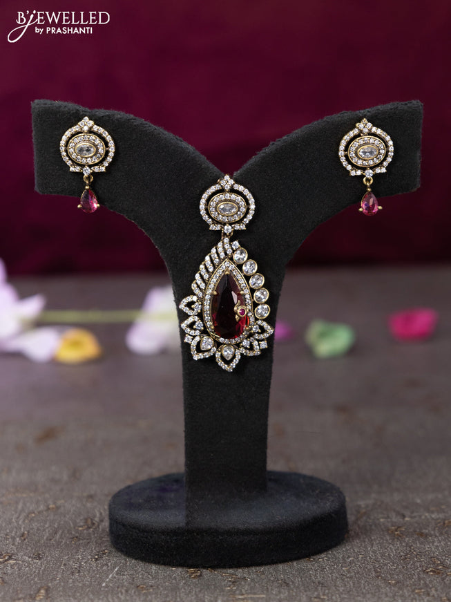 Victorian finish pendant set with ruby and cz stones