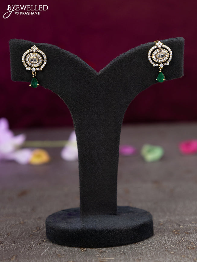 Victorian finish pendant set with emerald and cz stones