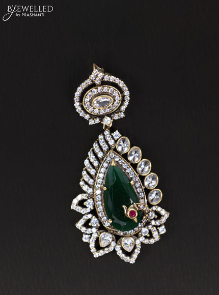 Victorian finish pendant set with emerald and cz stones