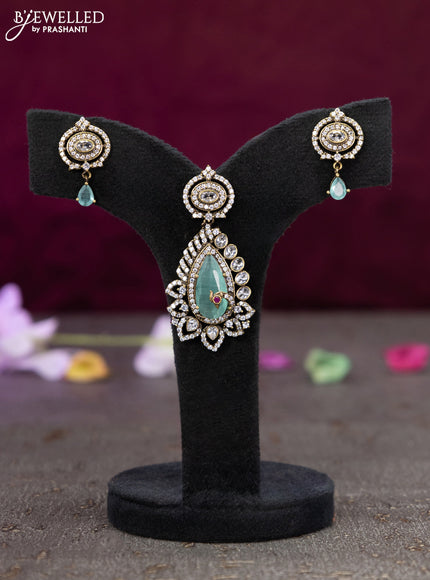 Victorian finish pendant set with mint green and cz stones