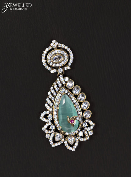 Victorian finish pendant set with mint green and cz stones