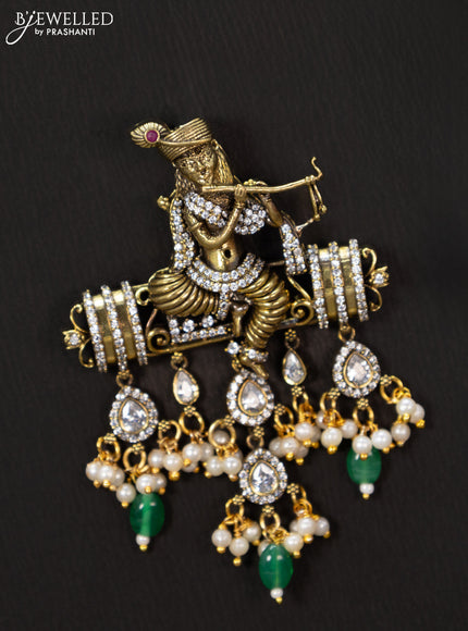 Victorian finish pendant set krishna design with cz stones and green beads hanging