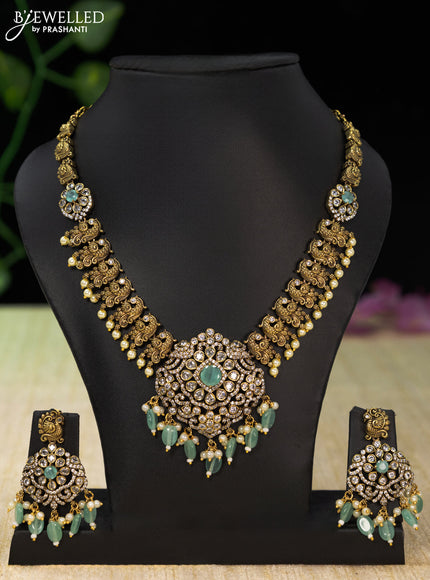 Necklace peacock design with mint green & cz stones and beads hangings in victorian finish