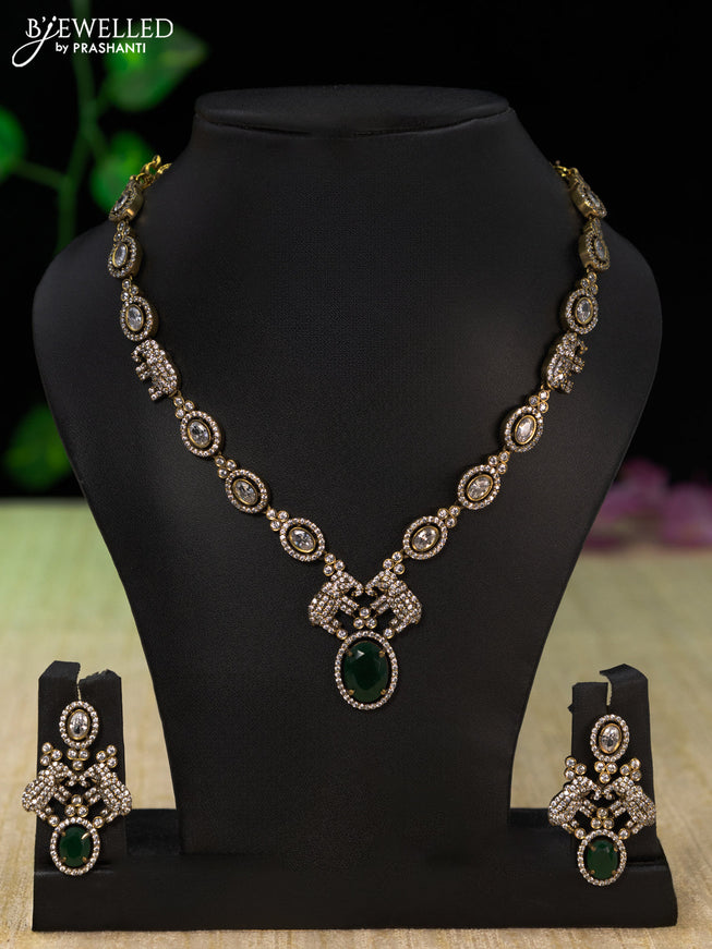 Necklace elephant design with emerald and cz stones in victorian finish