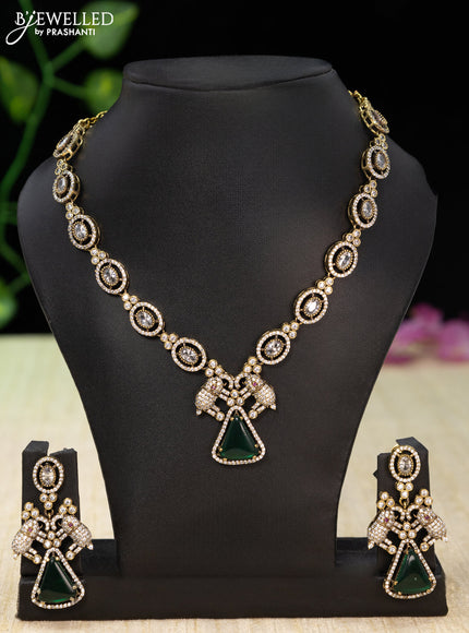 Necklace elephant design with emerald and cz stones in victorian finish