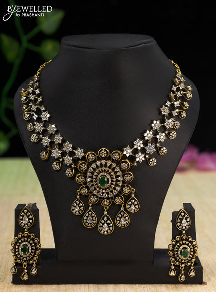 Necklace with emerald & cz stones and hangings in victorian finish