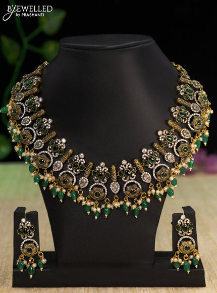 Necklace with emerald & cz stones and beads hangings in victorian finish