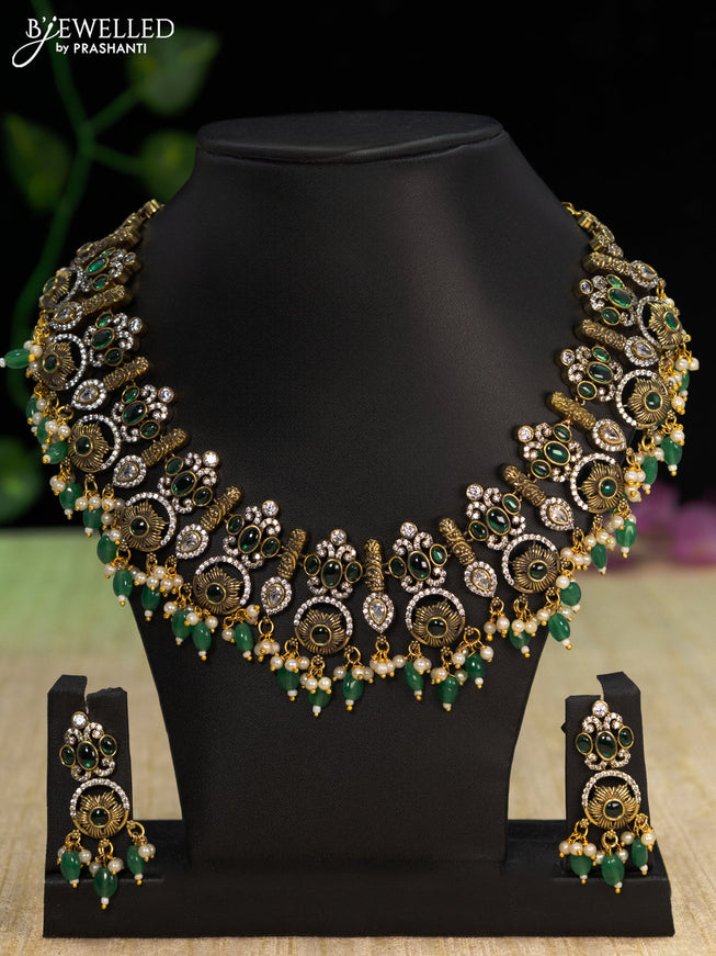 Necklace with emerald & cz stones and beads hangings in victorian finish