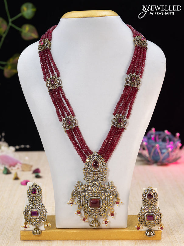 Beaded maroon necklace with ruby & cz stones and beads hanging in victorian finish