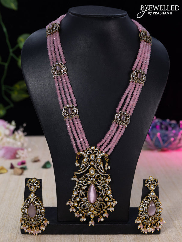 Beaded baby pink necklace with cz stones and beads hanging in victorian finish