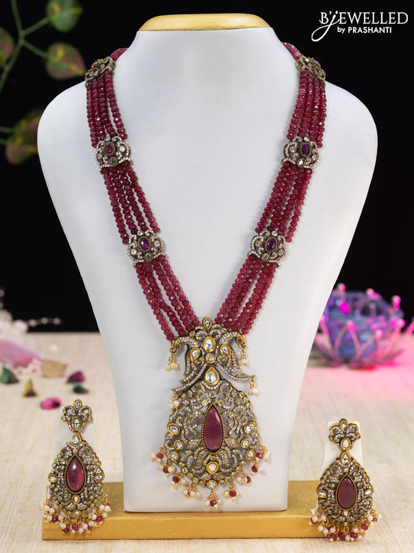 Beaded maroon necklace with ruby & cz stones and beads hanging in victorian finish