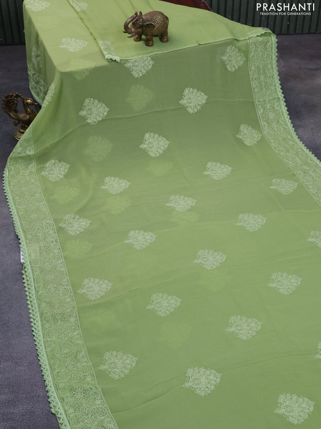 Chiffon saree pastel green with chikankari work buttas and lace work border