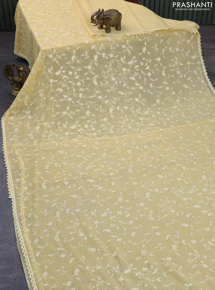 Chiffon saree pale yellow with allover chikankari & sequin work and lace work border