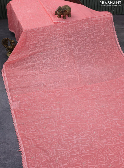 Chiffon saree peach pink with allover chikankari work and lace work border