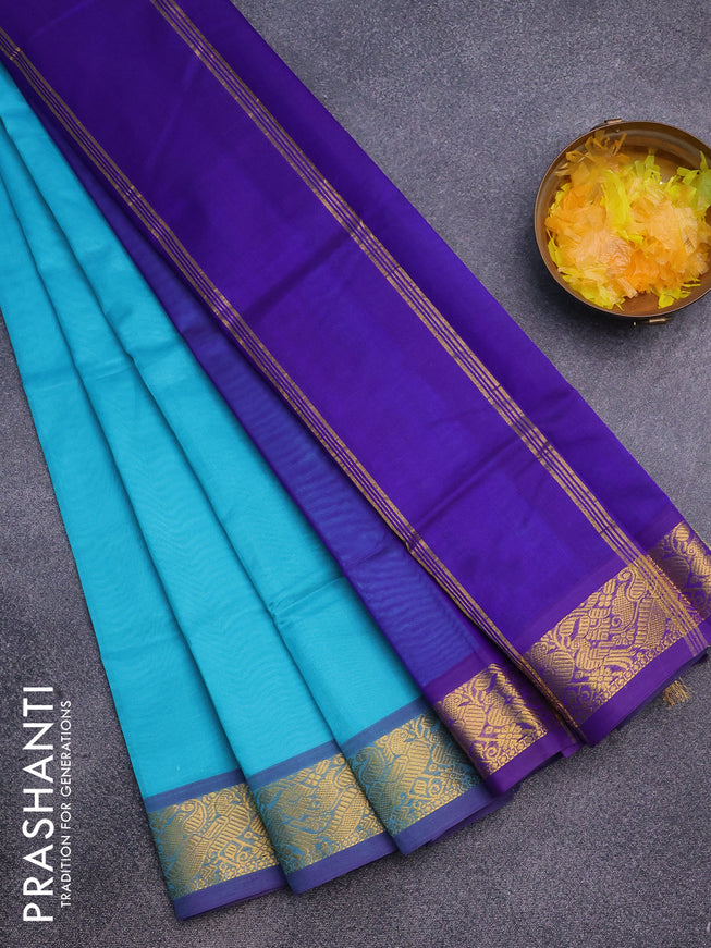 Silk cotton saree teal blue and blue with plain body and peacock zari woven border