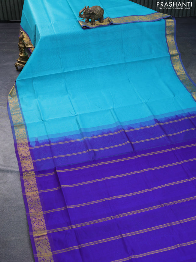 Silk cotton saree teal blue and blue with plain body and peacock zari woven border