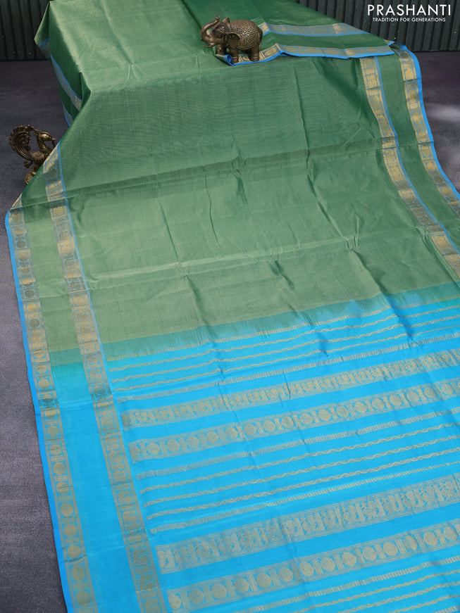 Silk cotton saree green shade and light blue with plain body and rettapet zari woven border