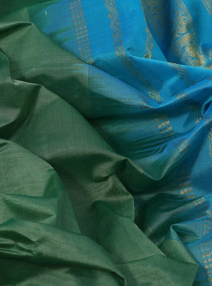 Silk cotton saree green shade and light blue with plain body and rettapet zari woven border