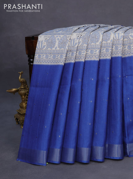 Semi tussar saree off white and blue with madhubani prints & zari buttas and zari woven border