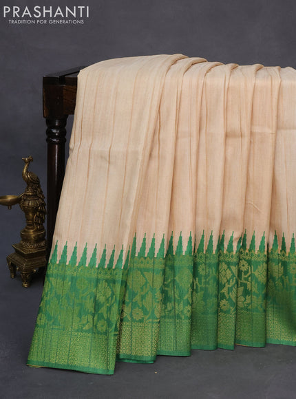 Semi tussar silk saree cream and green with plain body and long temple design ganga jamuna border