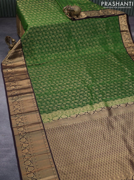 Roopam silk saree green and dark coffee brown with allover zari weaves and rich zari woven border