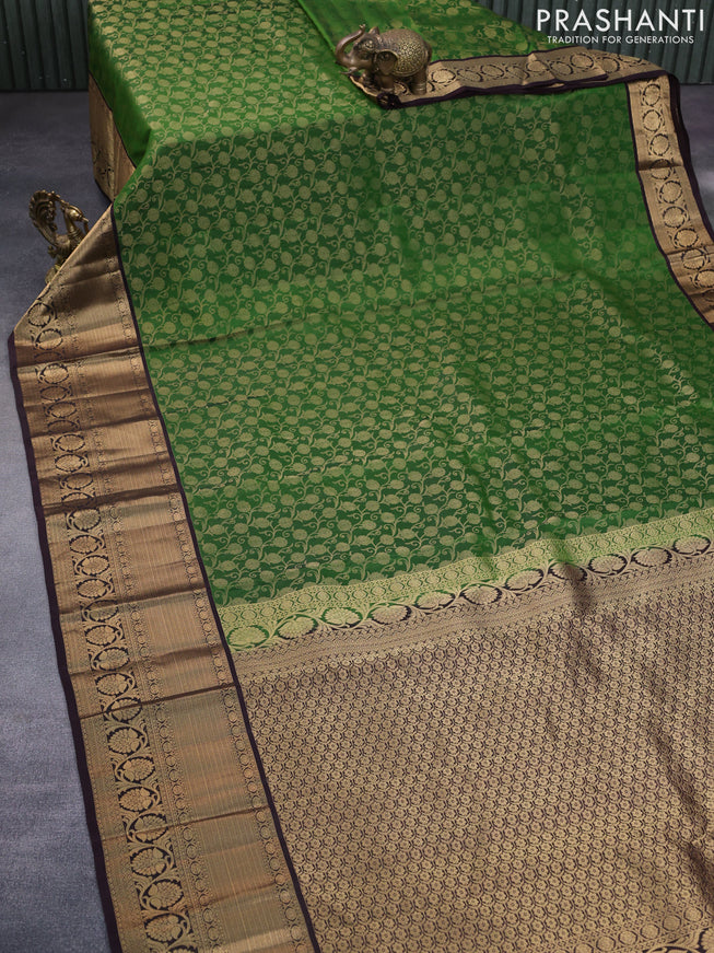 Roopam silk saree green and dark coffee brown with allover zari weaves and rich zari woven border