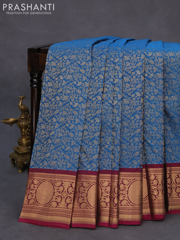 Roopam silk saree peacock blue and dark magenta pink with allover zari woven brocade weaves and zari woven border