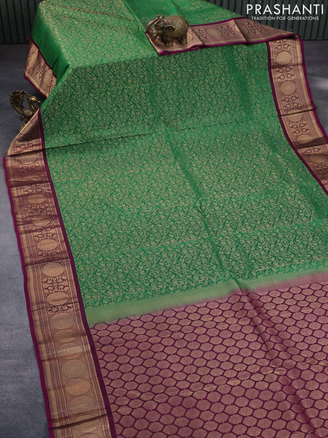 Roopam silk saree green and dark magenta pink with allover zari weaves and rich zari woven border