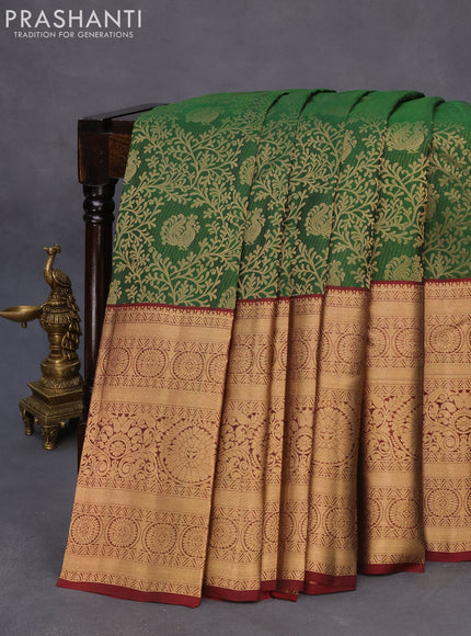 Roopam silk saree green and maroon with allover zari weaves and long rich zari woven border