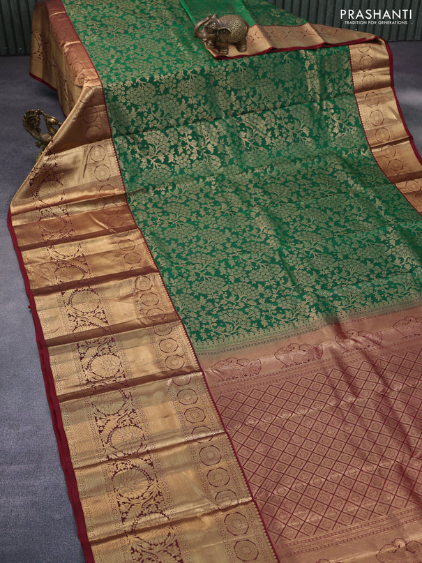 Roopam silk saree green and maroon with allover zari weaves and long rich zari woven border