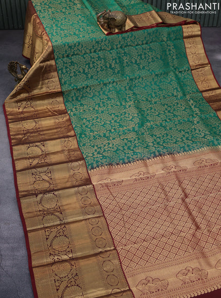 Roopam silk saree green and maroon with allover zari woven brocade weaves and long rich zari woven border