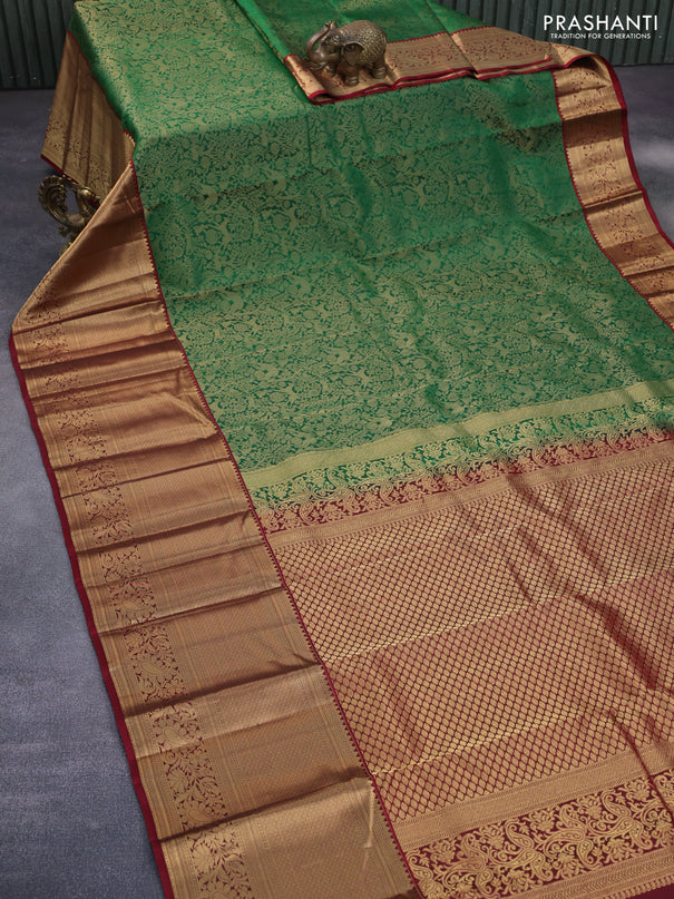 Roopam silk saree green and maroon with allover zari woven brocade weaves and long rich zari woven border