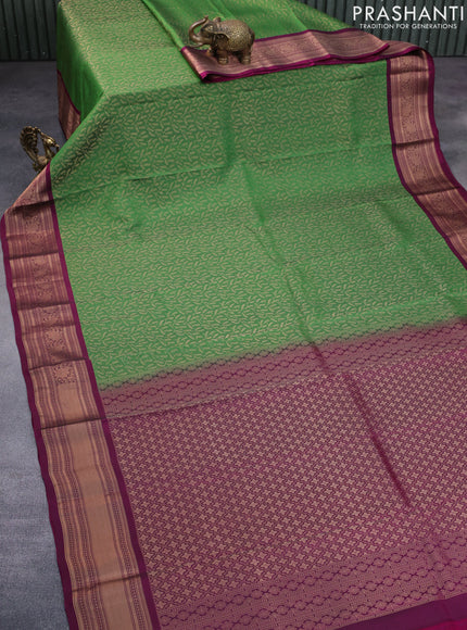 Roopam silk saree green and dark magenta pink with allover zari weaves and rich zari woven border