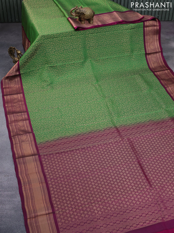 Roopam silk saree green and dark magenta pink with allover zari weaves and rich zari woven border