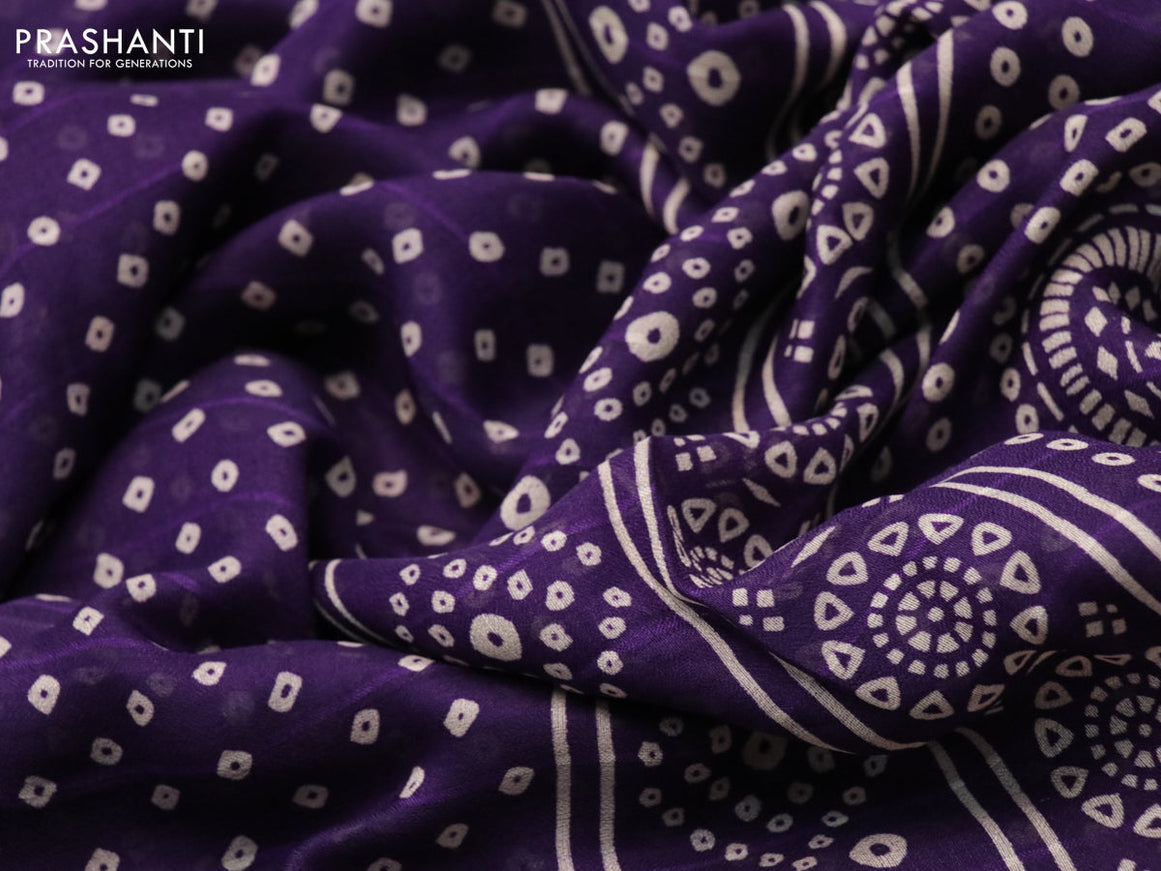 Semi georgette saree deep violet with allover bandhani prints and zari woven border