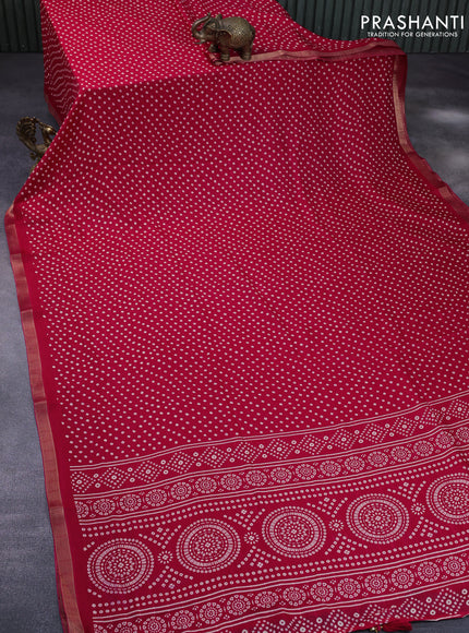 Semi georgette saree pink with allover bandhani prints and zari woven border