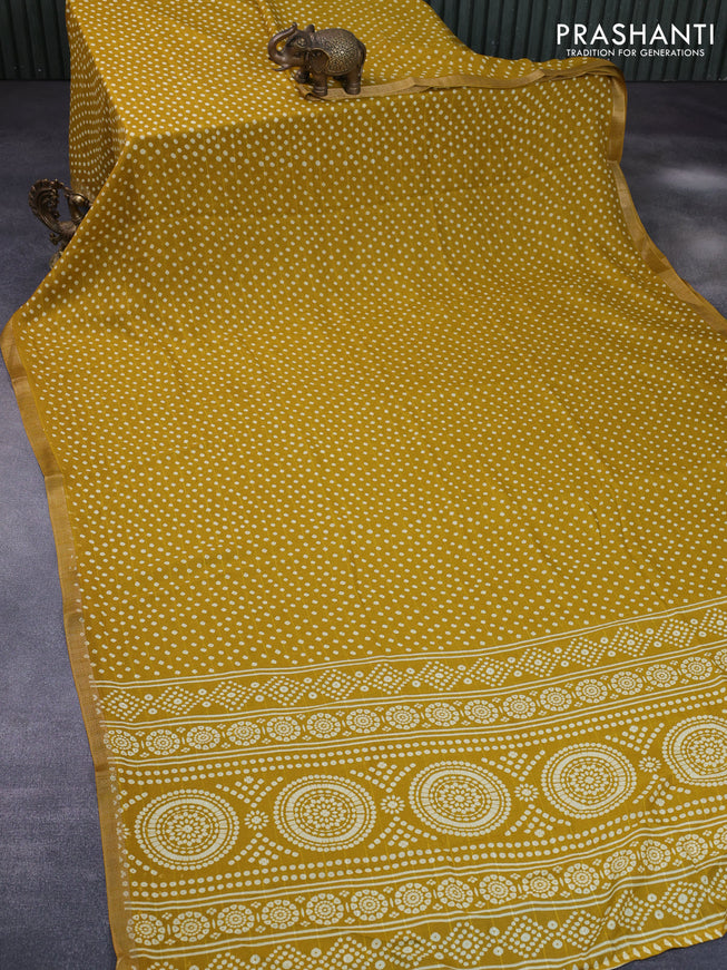 Semi georgette saree mustard yellow with allover bandhani prints and zari woven border