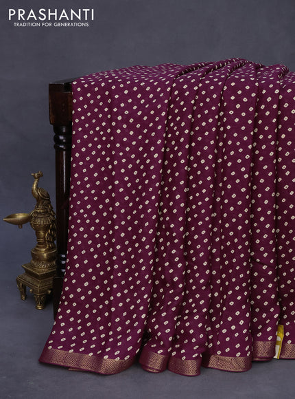 Semi georgette saree purple with allover bandhani prints and zari woven border