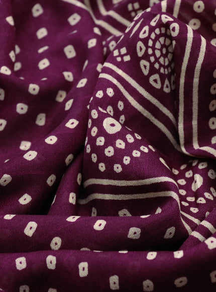 Semi georgette saree purple with allover bandhani prints and zari woven border