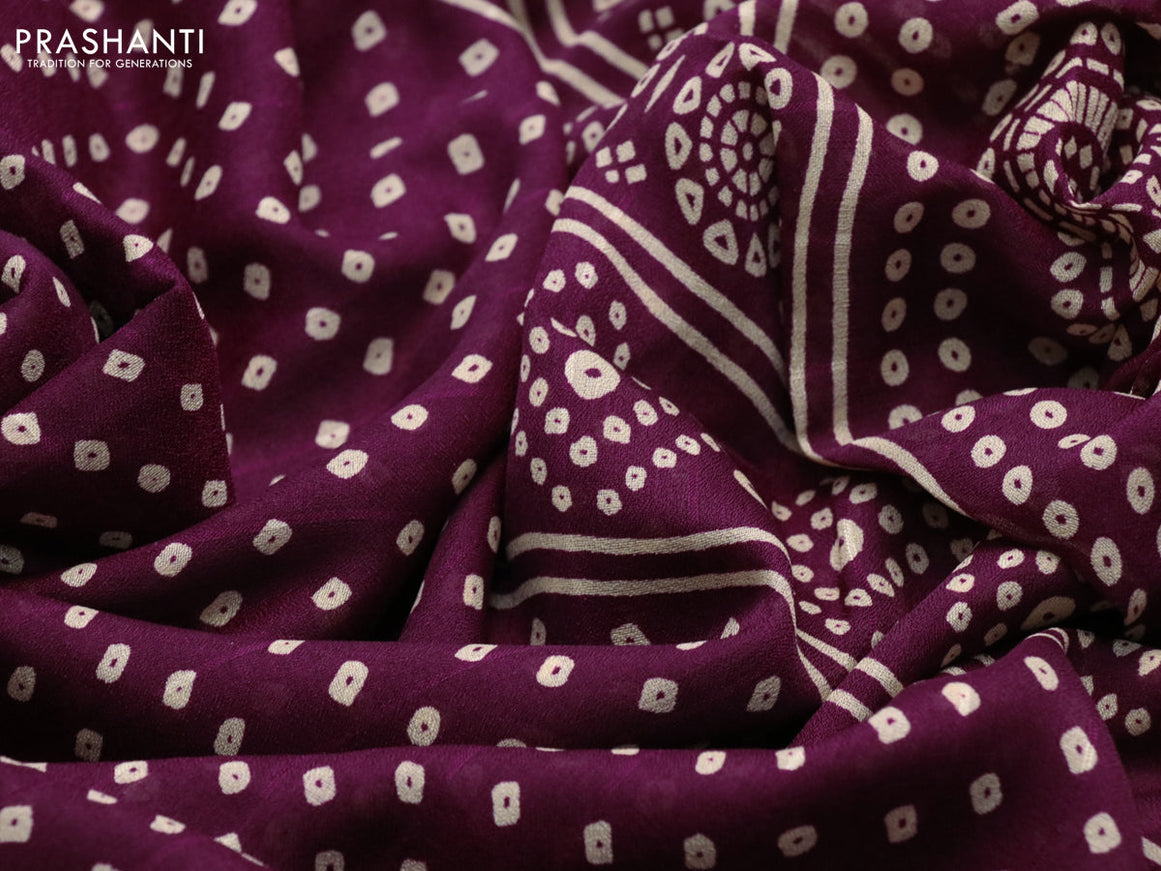 Semi georgette saree purple with allover bandhani prints and zari woven border