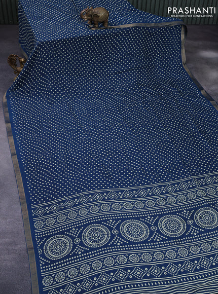 Semi georgette saree peacock blue with allover bandhani prints and zari woven border