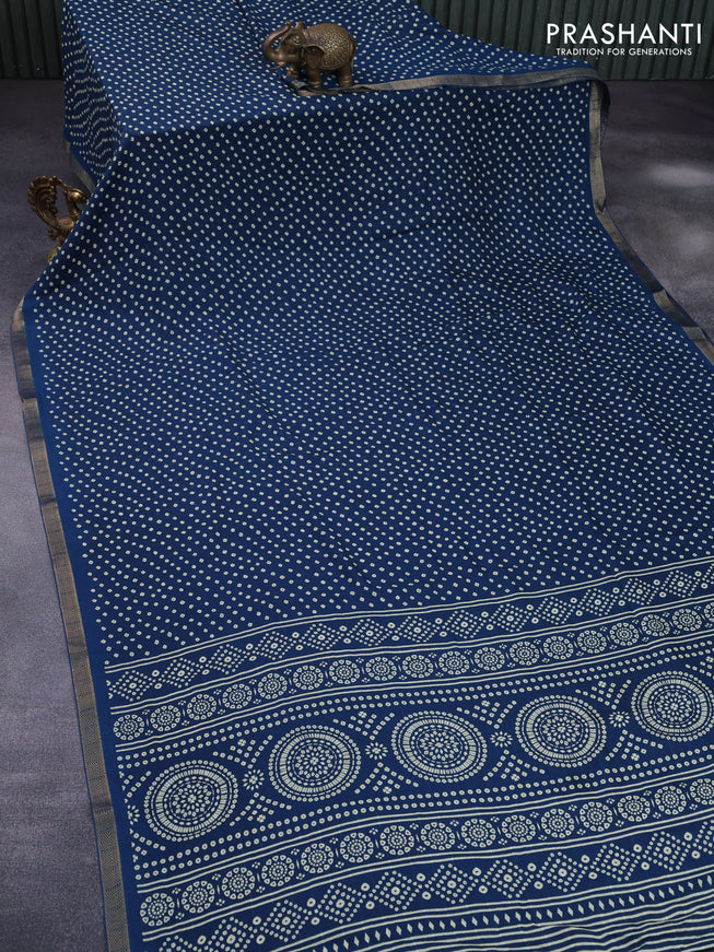 Semi georgette saree peacock blue with allover bandhani prints and zari woven border