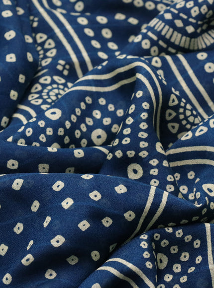 Semi georgette saree peacock blue with allover bandhani prints and zari woven border