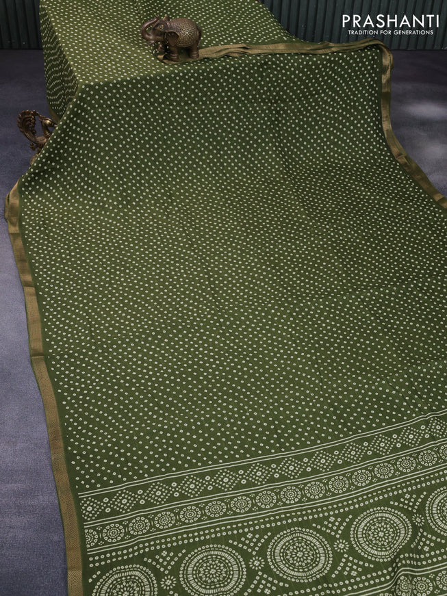 Semi georgette saree sap green with allover bandhani prints and zari woven border