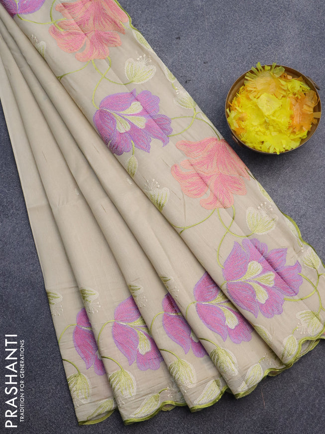 Semi raw silk saree cream with embroidery work buttas and floral design embroidery work border