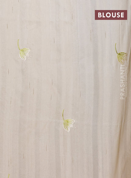 Semi raw silk saree cream with embroidery work buttas and floral design embroidery work border