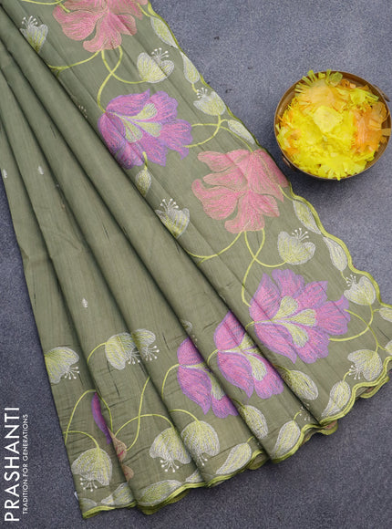 Semi raw silk saree sap green shade with embroidery work buttas and floral design embroidery work border