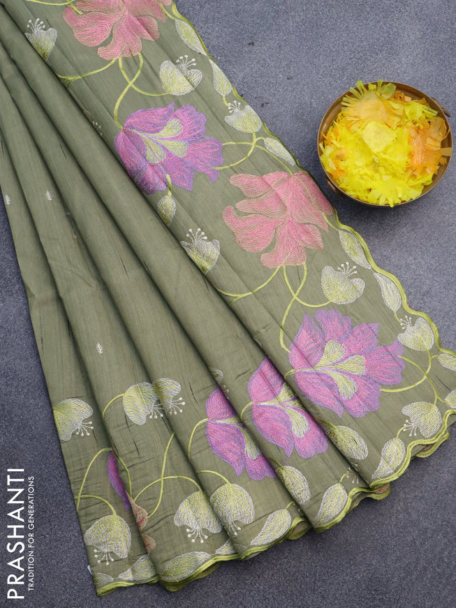 Semi raw silk saree sap green shade with embroidery work buttas and floral design embroidery work border