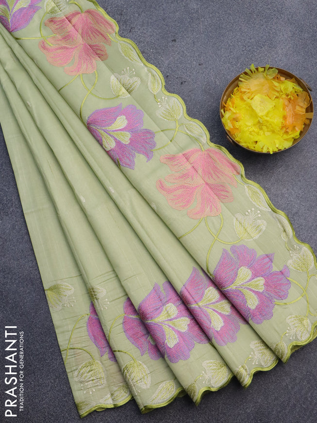 Semi raw silk saree pista green with embroidery work buttas and floral design embroidery work border