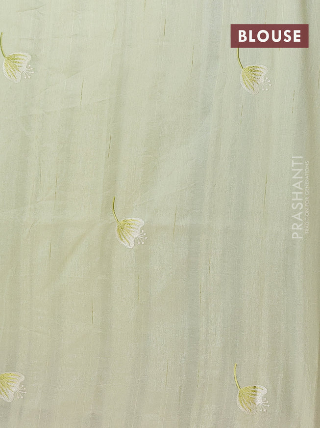 Semi raw silk saree pista green with embroidery work buttas and floral design embroidery work border